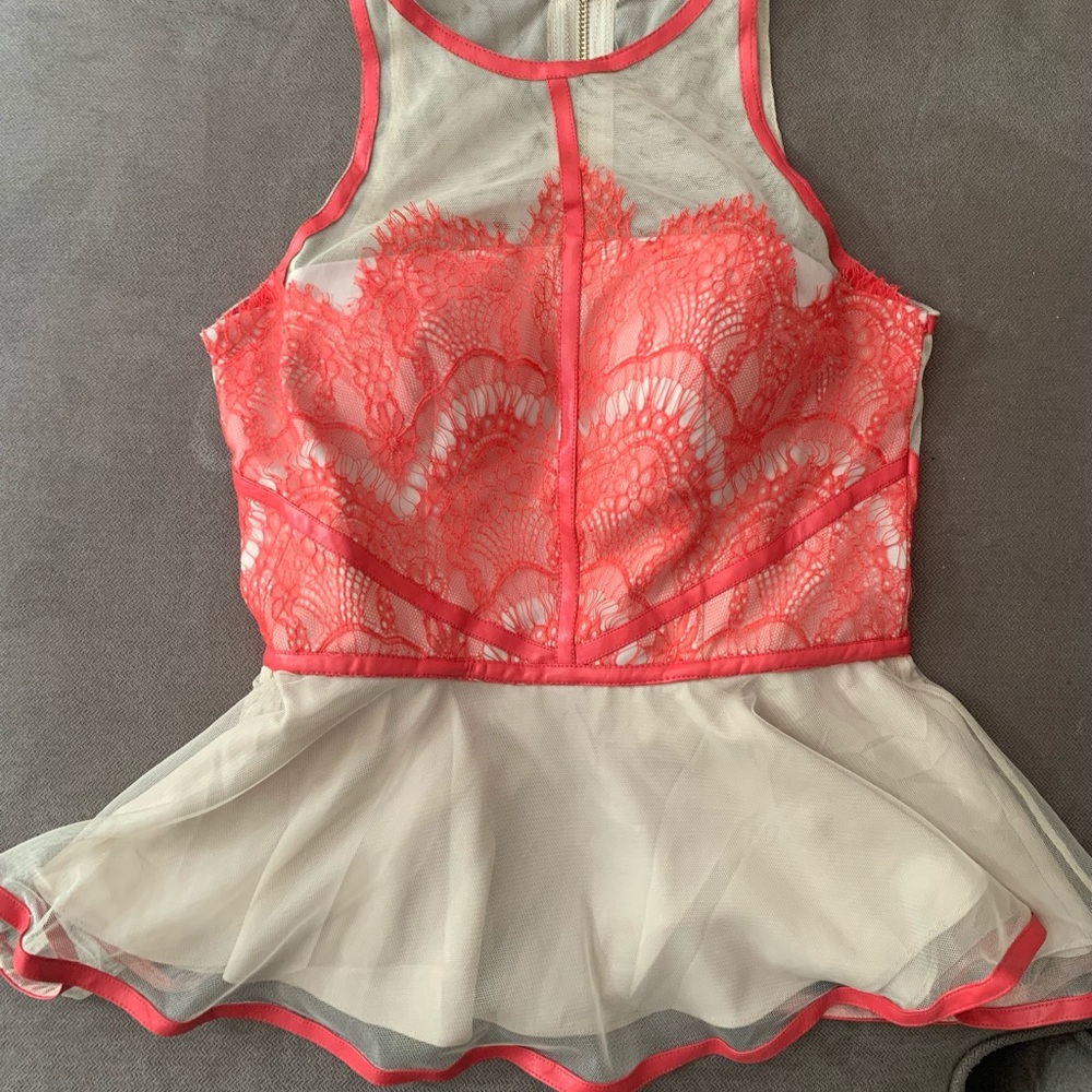 Lace appliqué peplum shirt